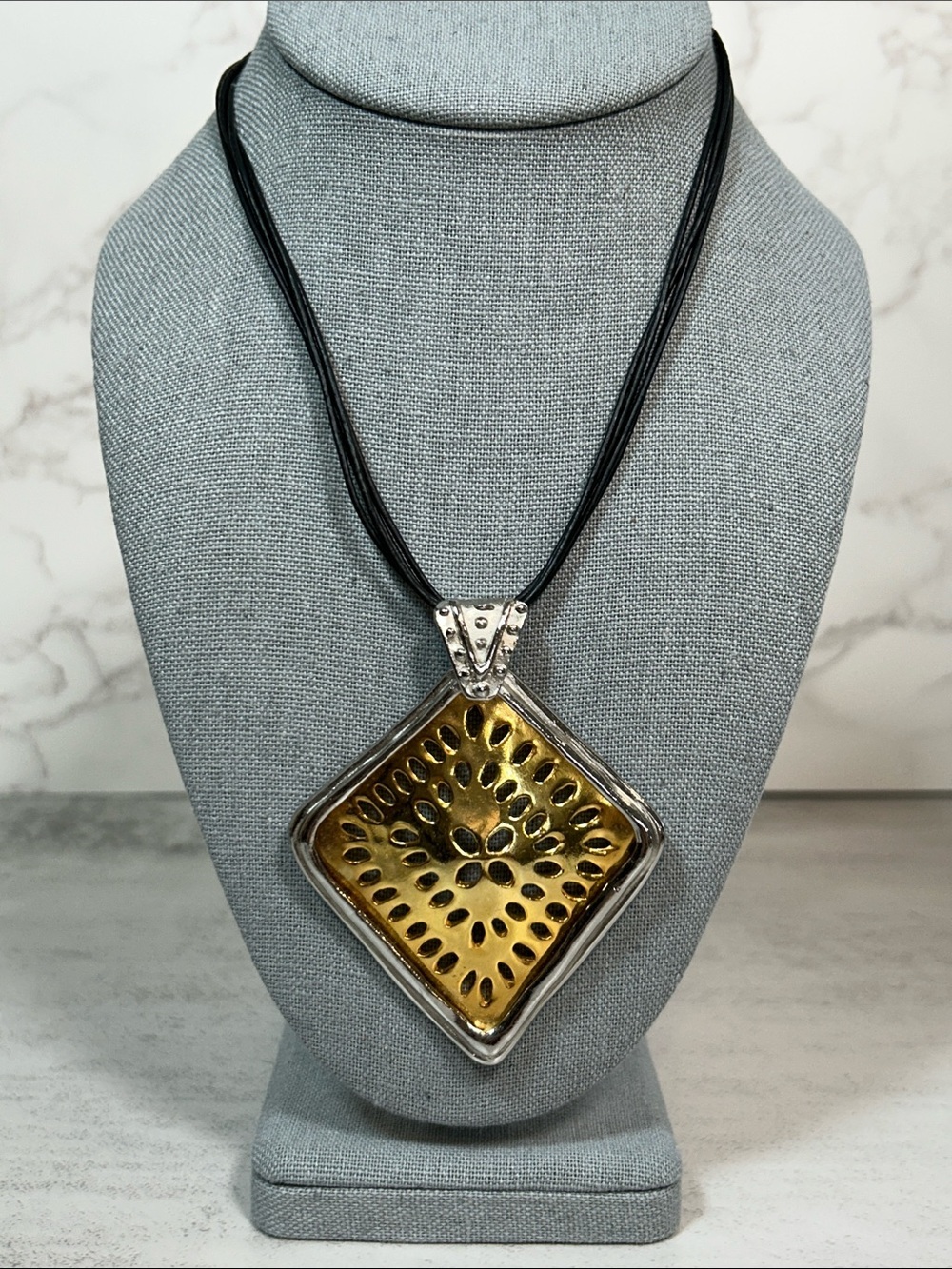 Chico's Gold and Silver Sunburst Pendant Necklace with Black Multi-Strand Cord
